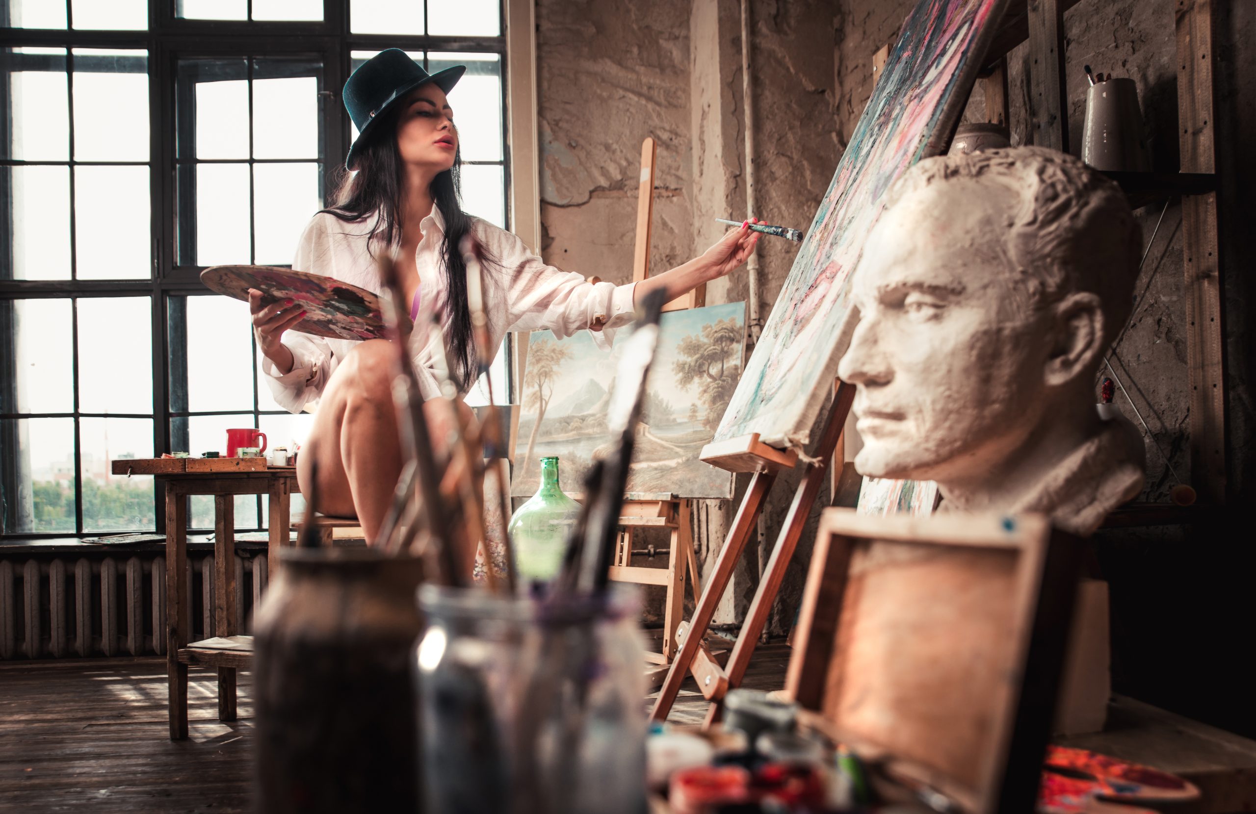 How do different art theories explain the purpose and meaning of art?